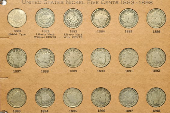 Partial collections of Shield, Liberty, and Buffalo nickels in a Wayte Raymond album