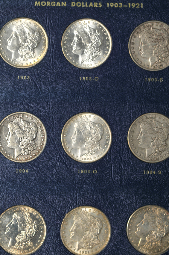 Collection of Morgan silver dollars, 1897 through 1921-S, in a Whitman 9429 album