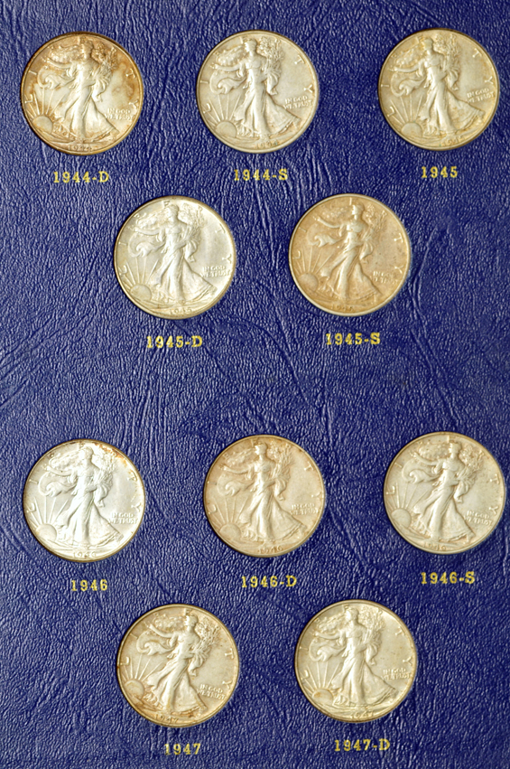 Complete collection of Walking Liberty half-dollars in two Whitman albums