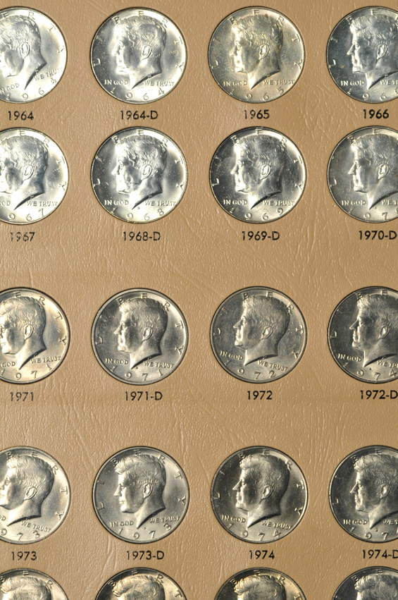 Collections of Roosevelt dimes, Franklin half-dollars, Kennedy half-dollars, and Sacagawea dollars, all in Dansco albums