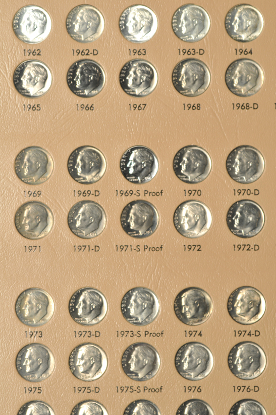 Collections of Roosevelt dimes, Franklin half-dollars, Kennedy half-dollars, and Sacagawea dollars, all in Dansco albums