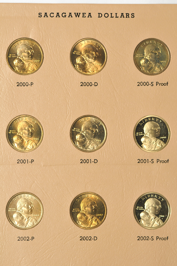 Collections of Roosevelt dimes, Franklin half-dollars, Kennedy half-dollars, and Sacagawea dollars, all in Dansco albums