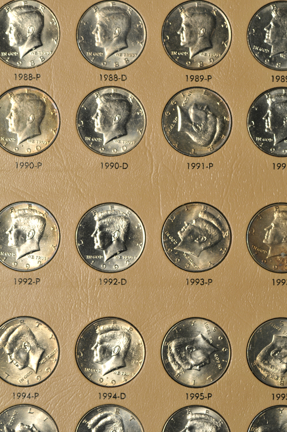 Collections of Roosevelt dimes, Franklin half-dollars, Kennedy half-dollars, and Sacagawea dollars, all in Dansco albums