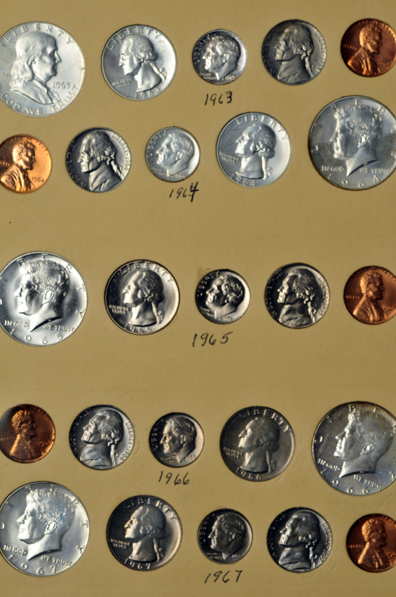 Collection of Proof Sets and Special Mint Sets in a Library of Coins album