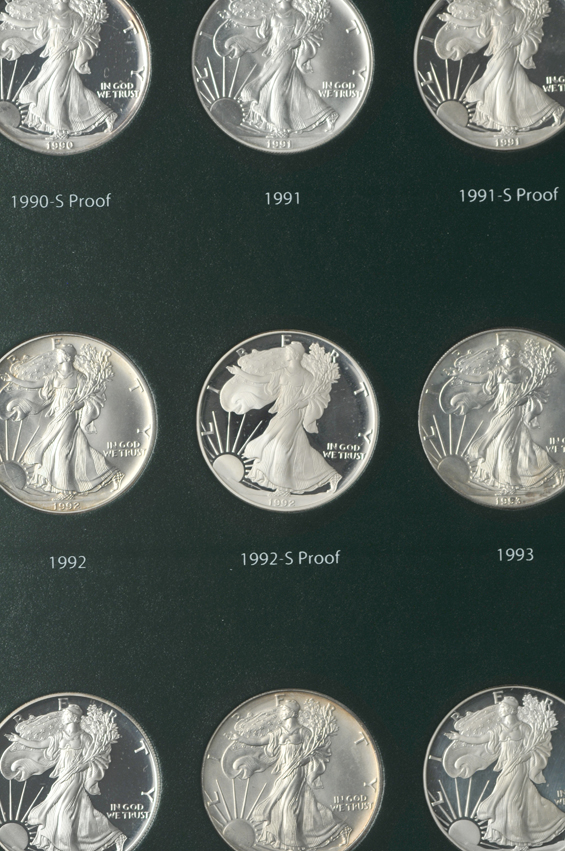 Collection of American Silver Eagles, including proof-only issues, 1986 through 2012-W, in two Intercept Shield albums
