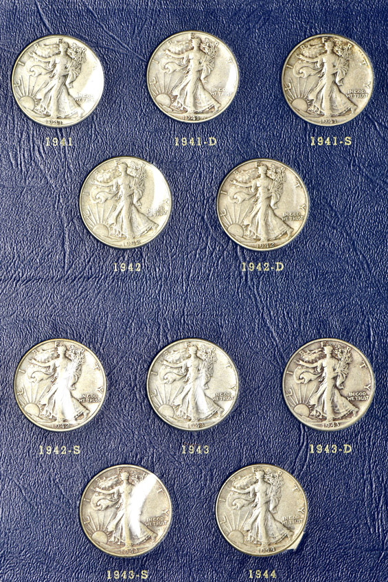 Complete collection of Walking Liberty half-dollars in two Whitman albums