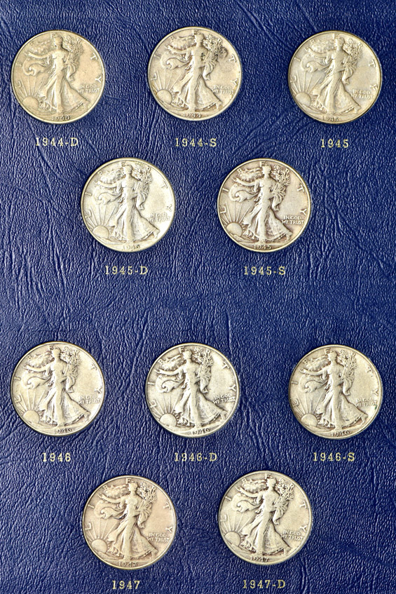 Complete collection of Walking Liberty half-dollars in two Whitman albums
