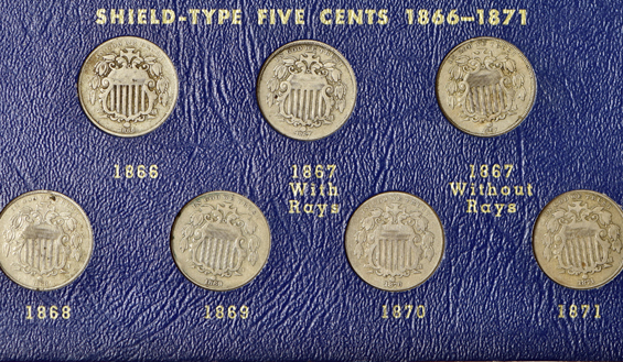 Forty-nine piece collection of two-cent pieces, three-cent pieces, Shield nickels, and twenty-cent pieces in a Whitman 9436 album