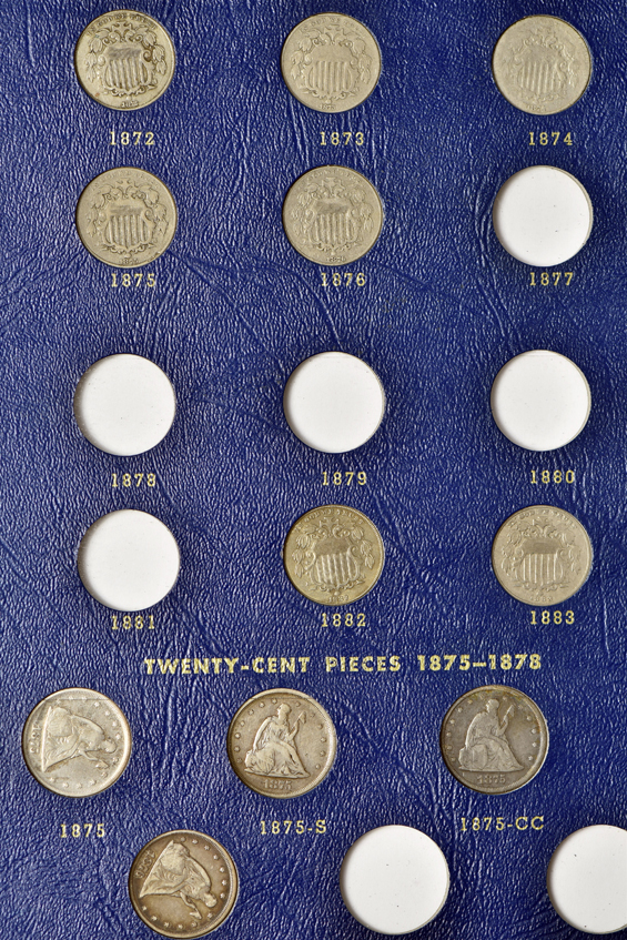 Forty-nine piece collection of two-cent pieces, three-cent pieces, Shield nickels, and twenty-cent pieces in a Whitman 9436 album