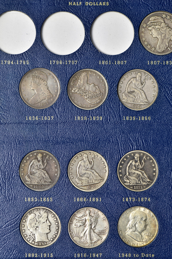 Collection of 57 US Large Type coins in three Whitman albums