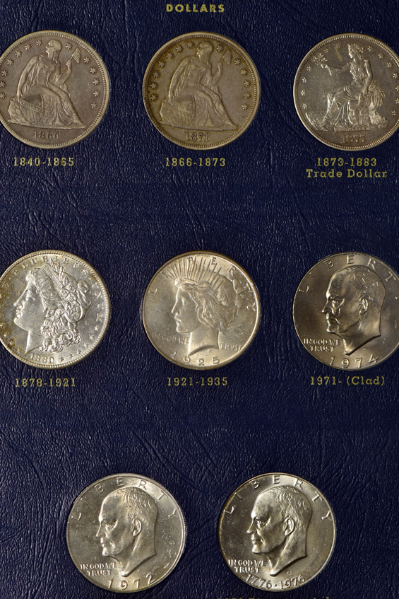 Collection of 57 US Large Type coins in three Whitman albums