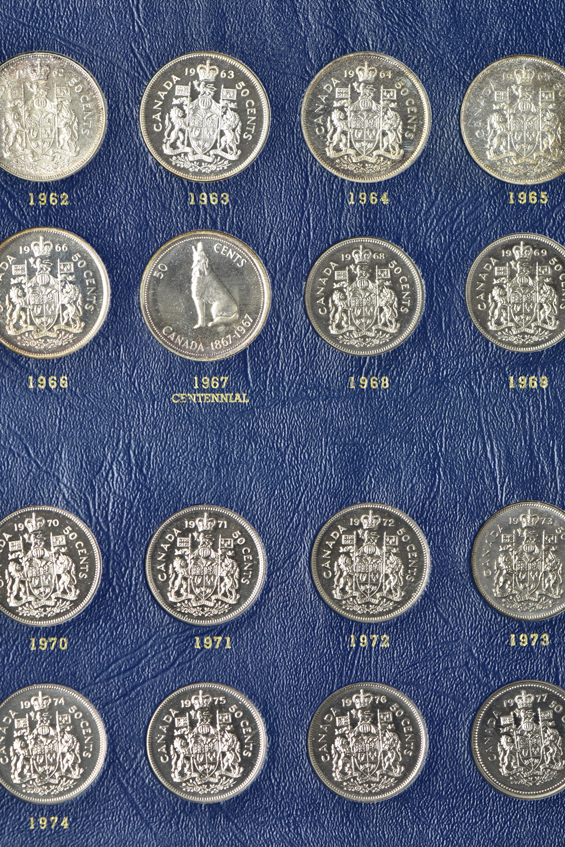 Canada - Complete album of fifty-cent pieces from 1937 though 1977 in a Whitman 9509 album.