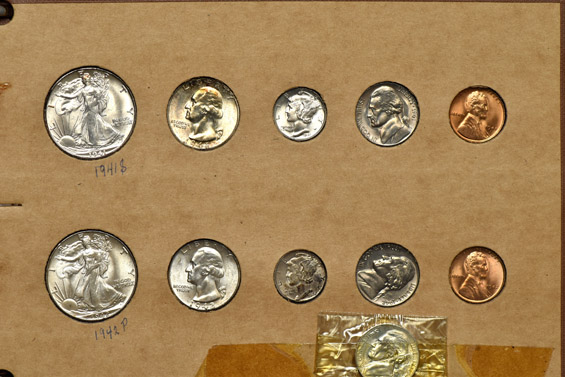 1941 through 1944 Mint State coins in a Wayte Raymond album.