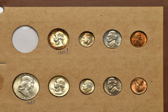 1945 through 1948 Mint State coins in a Wayte Raymond album.