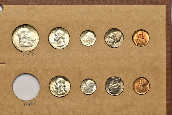 1945 through 1948 Mint State coins in a Wayte Raymond album.