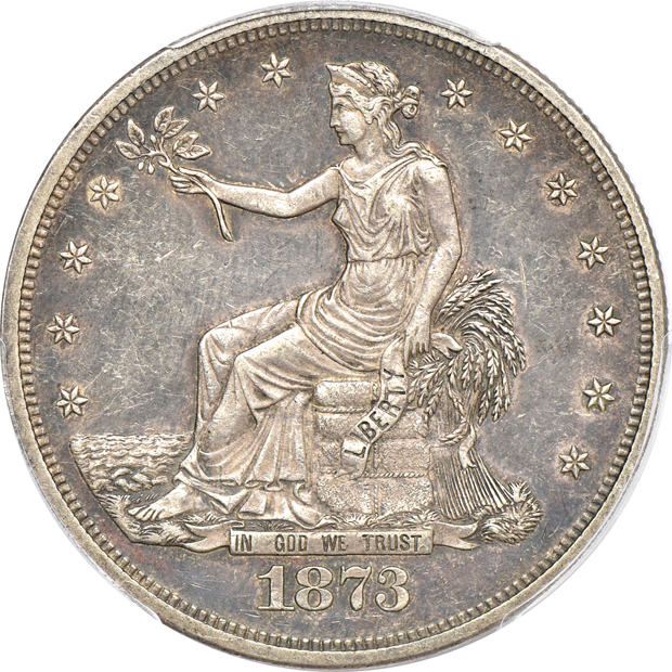 1873 Trade AU-50, and an 1876-CC Trade UNC details/cleaned, both PCGS