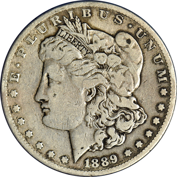 Nearly complete collection of ninety-seven Morgan silver dollars in four Capital Plastics holders.