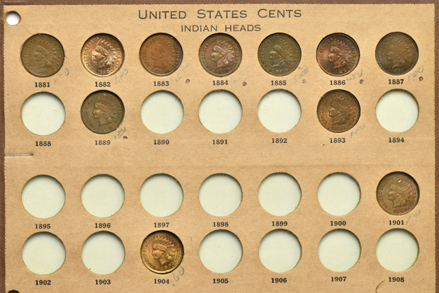 Three Flying Eagle and twenty Indian Head cents (some proof), in three Wayte Raymond pages