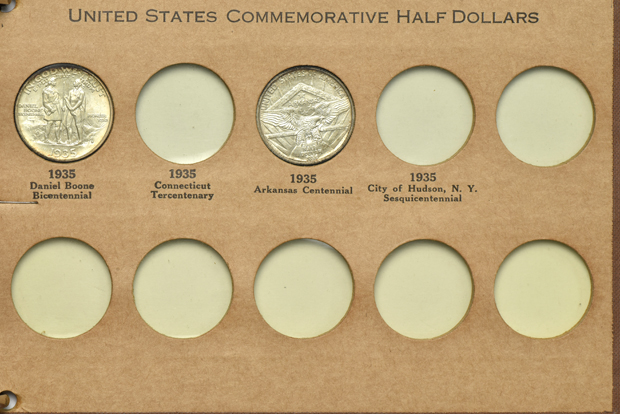 Twelve Silver Commemorative half-dollars in a Wayte Raymond album