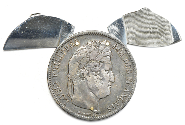 Two coin knives, plus a mix of world coins and tokens