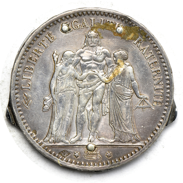 Two coin knives, plus a mix of world coins and tokens