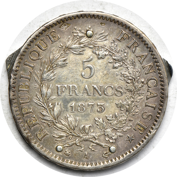 Two coin knives, plus a mix of world coins and tokens