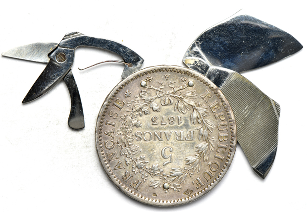 Two coin knives, plus a mix of world coins and tokens