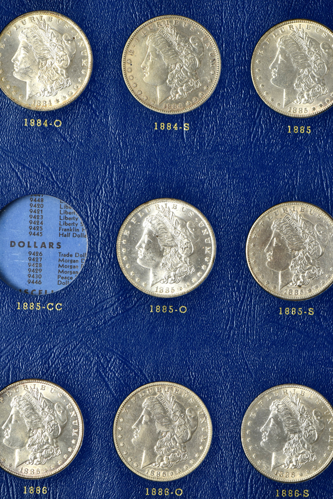 Collection of thirty-one different Morgan silver dollars, ranging from 1878 to 1886-S, in a Whitman 9427 album
