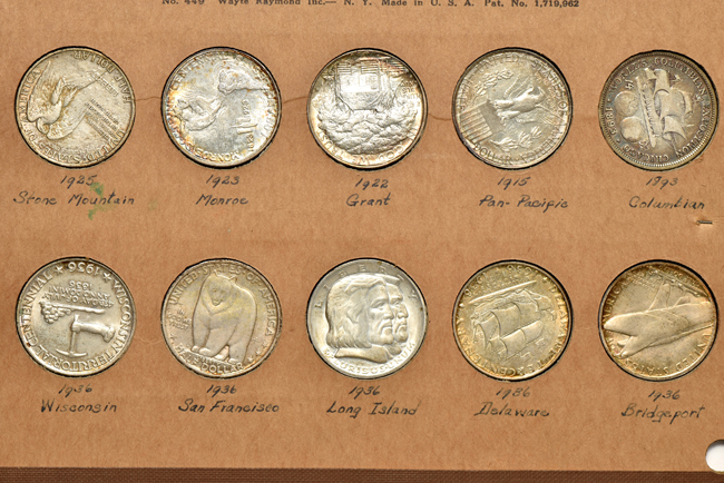 Twenty Silver Commemorative half-dollars in two Wayte Raymond pages