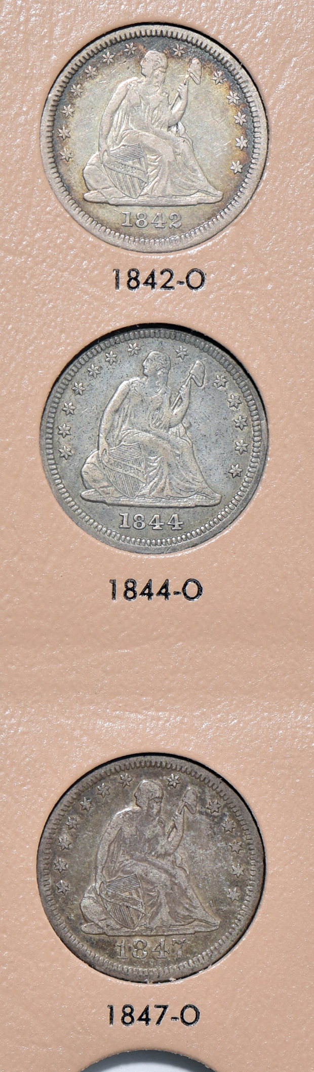 Twenty-six different Liberty Seated quarters in a Dansco 6142 album