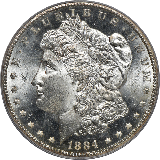 Four PCGS certified Morgan silver dollars