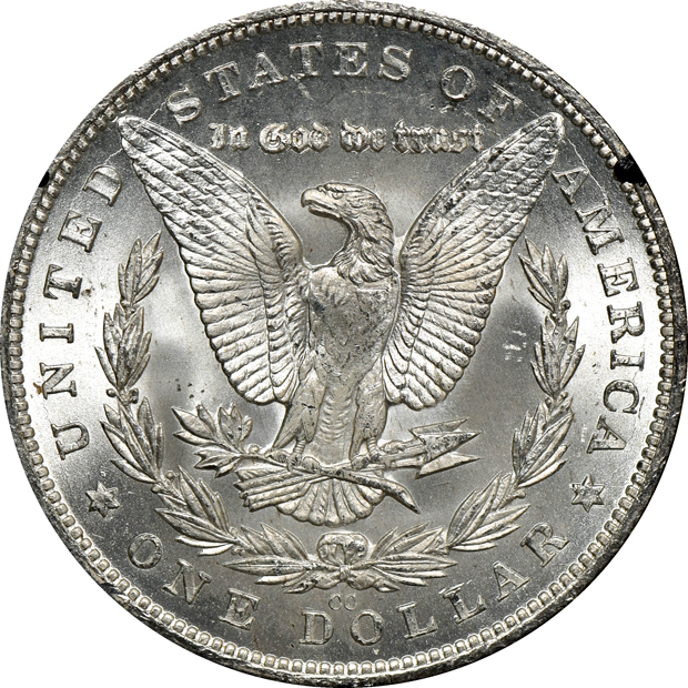 Five GSA Morgan silver dollars, as described
