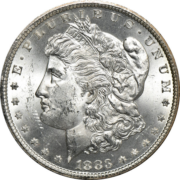 Five GSA Morgan silver dollars, as described