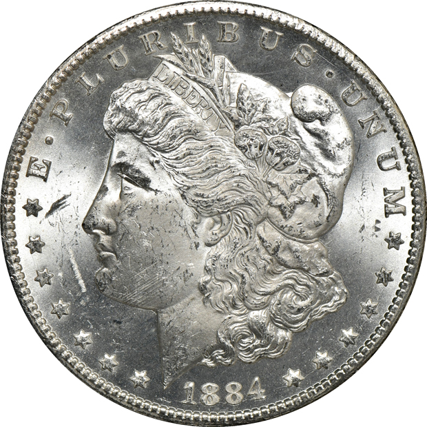 Five GSA Morgan silver dollars, as described