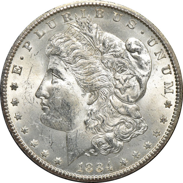 Five GSA Morgan silver dollars, as described