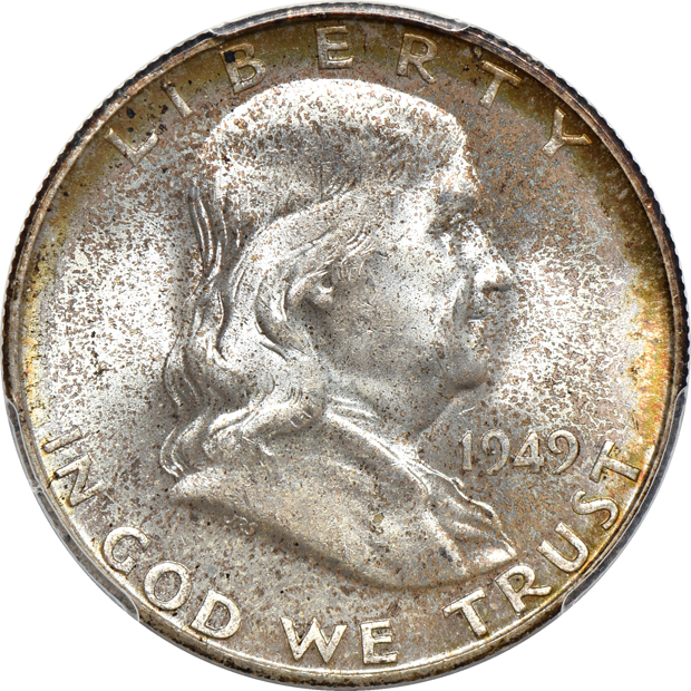 Seven Franklin half-dollars certified by PCGS
