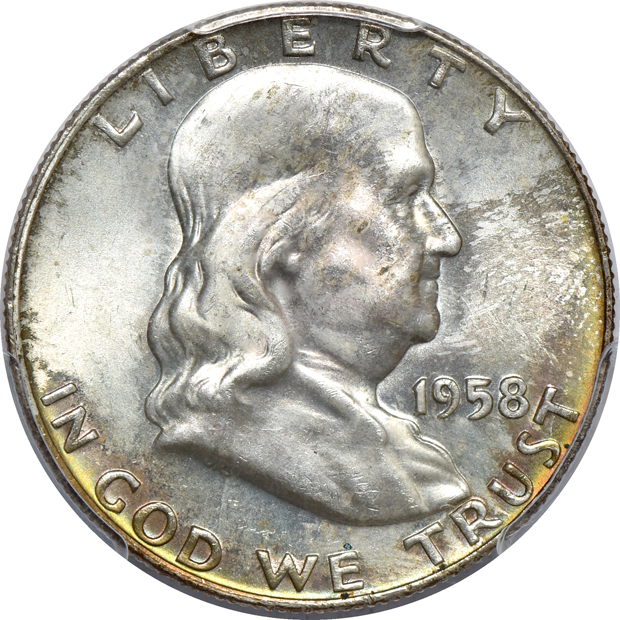 Seven Franklin half-dollars certified by PCGS