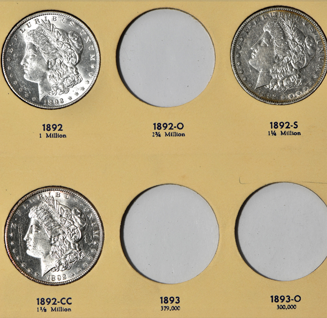 Seventeen different Morgan silver dollars in a Library of Coins Vol. 24 album