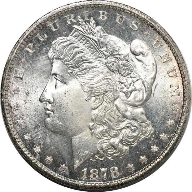 1874-S Trade dollar, counterstamped, and an 1878-CC Morgan silver dollar