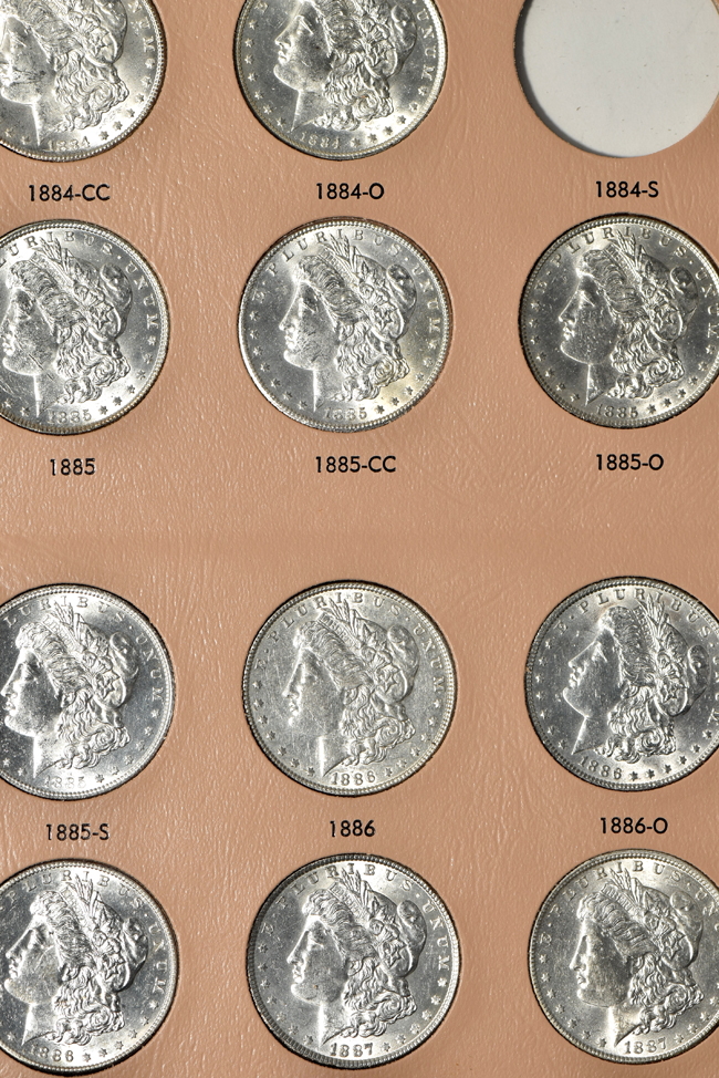Collection of forty-four different Morgan silver dollars in a Dansco 7178 album