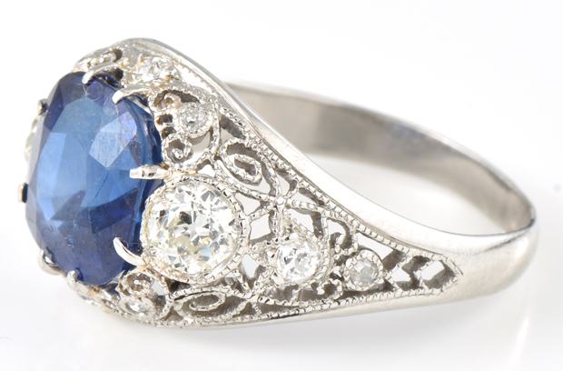 Platinum Diamond and Synthetic Sapphire Ring with a 4.32 ct. cushion cut synthetic sapphire in the center