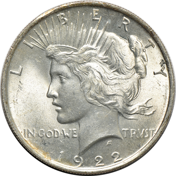 Twenty-four different Peace silver dollars, as described