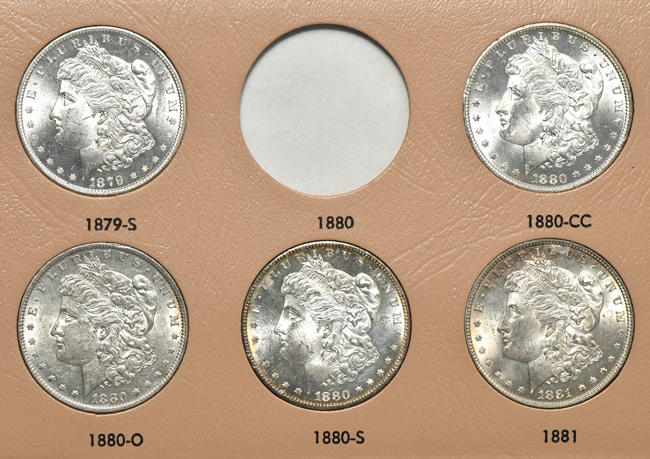 Collection of thirty-four different Morgan silver dollars in a Dansco 7178 album