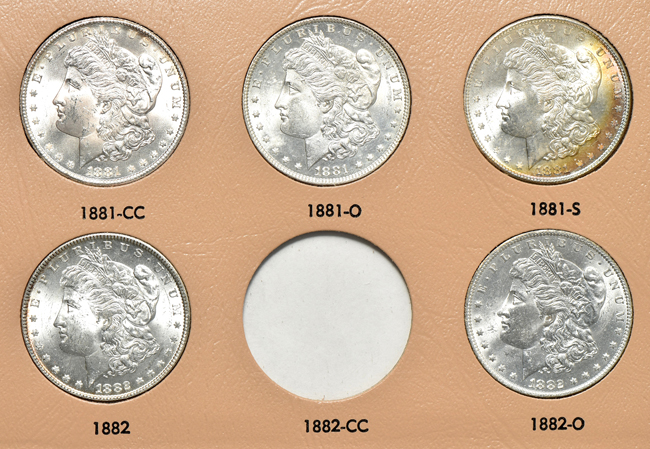 Collection of thirty-four different Morgan silver dollars in a Dansco 7178 album