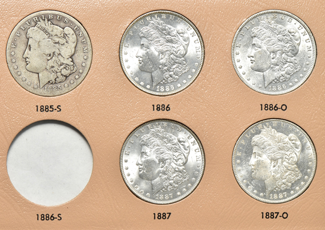 Collection of thirty-four different Morgan silver dollars in a Dansco 7178 album
