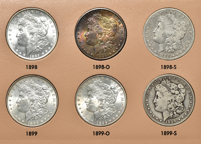 Collection of thirty-four different Morgan silver dollars in a Dansco 7179 album