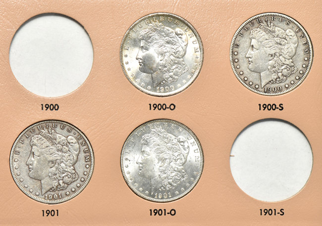 Collection of thirty-four different Morgan silver dollars in a Dansco 7179 album