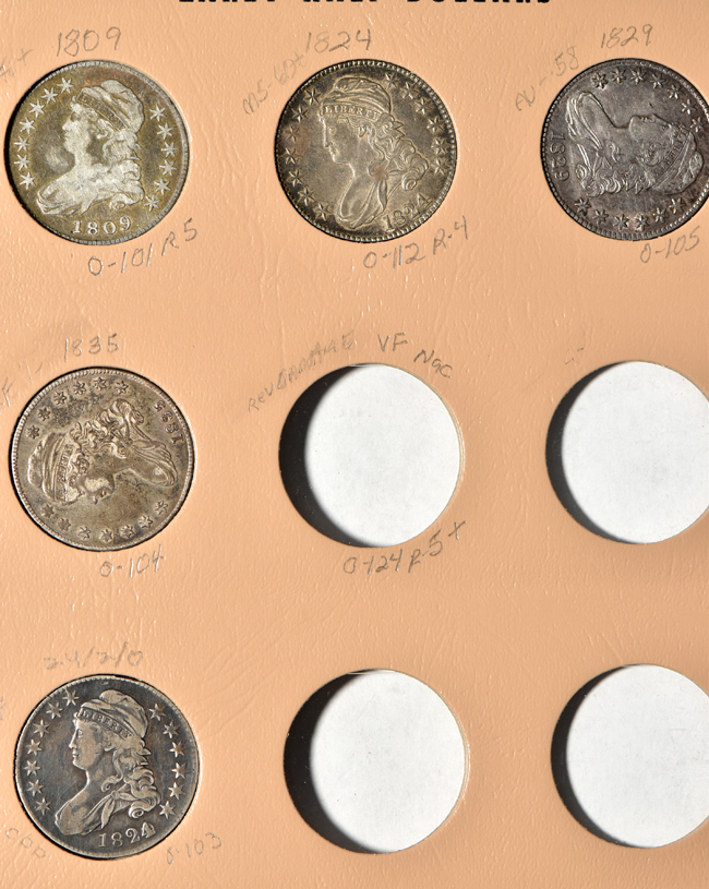 Twenty-four different early half-dollars in a Dansco 6151 Volume 2 album