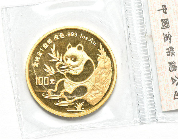 China - 1990 lg. date 1oz gold Panda 100 yuan sealed, and a 1991 sm. date 1oz  gold Panda 100 yuan sealed with ribbon