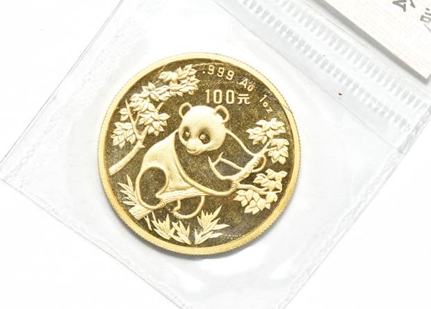 China - 1992 sm. date 1oz gold Panda 100 yuan sealed with ribbon, and a 1993 lg. date 1oz gold Panda 100 yuan sealed with ribbon